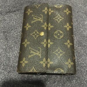 Luis Vuitton very loved project piece.  Passport size tri fold large wallet.